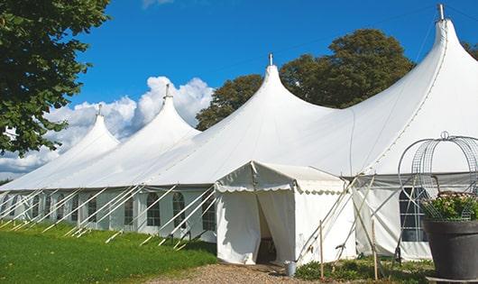 a line of sleek and modern portable toilets ready for use at an upscale corporate event in Mountain City